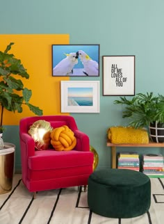 a living room filled with furniture and plants on top of a hard wood flooring