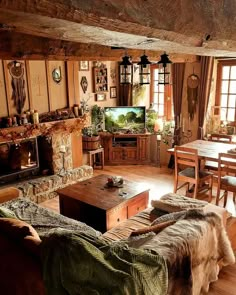 a living room filled with furniture and a flat screen tv sitting on top of a wooden table