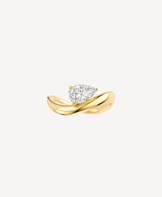 a yellow gold ring with a single diamond