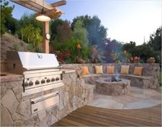 an outdoor bbq with seating around it