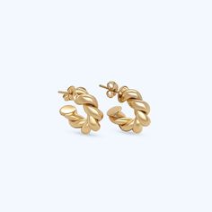 Named after our mother/grandmother, the Barbara twisted earrings are a modern take on a pair of her much loved hoops. Two intertwined polished gold strands create the classic circular shape. **Gold filled 14k gold over brass. *Waterproof. 3 Sizes Barbara diameter is 1.25" Mini Barbara diameter is .75" Huggie diameter is .50" *Waterproof but will be damaged by chlorine and other harsh liquids. **Our gold filled earrings have layers of 14k gold over brass. They have the look and color of solid gol Twisted 14k Yellow Gold Earrings, Twisted 14k Gold Earrings, Gold Twisted Huggie Earrings As Gift, Modern Twist Yellow Gold Earrings With Polished Finish, Modern Twist Polished Yellow Gold Earrings, Modern Twist Gold Plated Twisted Jewelry, Tarnish Resistant Twisted Yellow Gold Jewelry, Everyday Twisted Yellow Gold Jewelry, Twisted Yellow Gold Jewelry For Everyday