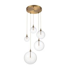 three glass globes hanging from a brass ceiling fixture with four lights on each side