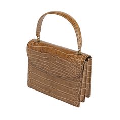 Isabella is presented in the finest brown authentic alligator leather, making it the perfect choice for formal events. This upscale handbag features high-quality Cafe Glossy alligator leather for the main body, gussets, back body, top flap, handle, bottom, vistas, and pouch, offering a luxurious and cohesive texture. Handcrafted by generational artisans, Isabella exemplifies meticulous craftsmanship and timeless elegance, ensuring that it stands out in any setting. The rich Cafe Glossy alligator leather provides a sophisticated and exotic look, while the sturdy handle blends style and functionality effortlessly. Formal Handheld Shoulder Bag With Crocodile Pattern, Formal Handheld Crocodile Pattern Shoulder Bag, Classic Brown Evening Bag With Top Handle, Luxury Brown Satchel Evening Bag, Elegant Rectangular Satchel With Crocodile Pattern, Elegant Brown Crocodile Pattern Shoulder Bag, Formal Crocodile Pattern Rectangular Shoulder Bag, Elegant Crocodile Pattern Rectangular Satchel, Luxury Formal Satchel With Crocodile Pattern