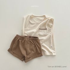 Description: This is a two-piece cozy, comfy sleeveless top with pocket and matching short set. The shorts have an elastic waistband. This set is perfect for the summer months! Size: 2T 3T 4T 5 6 7 8 9 Care Instructions: Machine wash cold, gentle cycle, hang dry for best results or tumble dry low. 100% Cotton REMINDER: For Child's safety, garment should fit snugly. Short Sleeve Sets With Pockets For Playwear, Playwear Sets With Pockets And Short Sleeves, Cute Cotton Sets With Pockets, Casual Cotton Short Set For Playwear, Casual Beige Tops For Playwear, Casual Solid Color Cotton Short Set, Solid Cotton Sets With Pockets, Casual Playwear Sets With Pockets, Cotton Tops With Pockets For Playwear