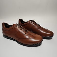 Brand New Shoes With Box Any Questions Comment Below Cognac Leather Oxfords For Business Casual, Business Sneakers In Calf Leather With Plain Toe, Cognac Moc Toe Leather Shoes For Business, Brown Low-top Leather Shoes For Business, Brown Low-top Shoes For Business Casual, Business Leather Low-top Shoes, Luxury Brown Moc Toe Oxfords, Plain Toe Cognac Leather Shoes For Business Casual, Cognac Plain Toe Leather Shoes For Business Casual