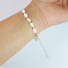 This romantic FRESHWATER PEARL Bracelet is made of a very fine quality of  Fresh Water pearls and 925 sterling silver for your special days! Freshwater pearls are real, cultured pearls, grown in lakes, rivers, as well as ponds. Most Freshwater pearls are white and resemble Akoya pearls, but they also produce a variety of pastel shades, including pink, lilac and peach. Measurements:- This Bracelet is 9 inches (adjustable) around your hand. ► ABOUT YOUR ORDER * All items are neatly packaged in our beautiful jewelry boxes and elegant organza bags. * All items are 100% gift-ready. * Each order comes with a personalized handwritten card and a branded Millennium Bride jewelry cloth. * Each order comes with a free gift. ► PERSONALIZTION * If your order is a gift, you may contact us with the recip Silver Single Strand Bracelet As Gift, Adjustable Hypoallergenic Sterling Silver Anniversary Bracelet, Adjustable Hypoallergenic Sterling Silver Bracelet For Anniversary, Silver Single Strand Beaded Bracelet Gift, Silver Single Strand Beaded Bracelets As Gift, Adjustable White Gold Pearl Bracelet, Minimalist Sterling Silver Pearl Bracelet For Wedding, Elegant Silver Resizable Beaded Bracelets, Silver Pearl Bracelets With Adjustable Chain