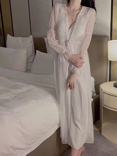 Silk Sleepwear Ensemble
Main fabric: 97.7% polyester fiber 2.3% spandex
Lining: 90% nylon, 10% spandex
Lace base fabric: 100% nylon
Water-soluble embroidery thread: 100% polyester fiber




Size/cm


Bust


Length


Waist


Fit weigh




M


79


110.5


72


40-55kg




L


83


110.5


76


50-60kg




XL


87


110.5


80


60-70kg








Robe Size/cm


Length


Bust


Shoulder


Fit weigh




One size/L


118


102


32


40-70kg





 	The above size is manually measured by “tiling-stretch White V-neck Nightgown For Pajama Party, Stretch V-neck Nightgown For Bedtime, White V-neck Robe For Sleep, Spring Long Sleeve Nightgown For Night, White V-neck Sleepwear For Sleepover, Sheer V-neck Sleepwear For Sleepovers, White Long Sleeve Nightgown For Sleep, Long Sleeve White Nightgown For Sleep, White Long Sleeve Nightgown For Lounging