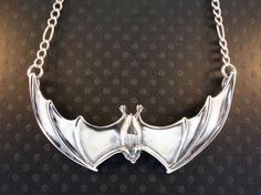 Bat Necklace Silver Bat Pendant Large Spread Winged by martymagic, $160.00 Silver Jewelry With Oxidized Finish For Halloween, Silver Winged Fantasy Jewelry, Silver Fantasy Necklace For Halloween, Silver Vampire Costume Jewelry, Silver Vampire Style Costume Jewelry, Silver Wing-shaped Fantasy Jewelry, Silver Fantasy Necklace With Hand Cast, Silver Fantasy Wing-shaped Jewelry, Collectible Vampire Jewelry For Halloween