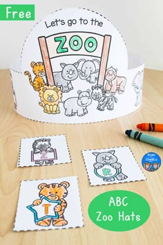 a paper crown with zoo animals on it and some crayons to the side