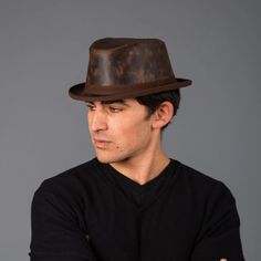 This packable leather fedora that keeps its looks is the piece you need for all ocasions.  This lightweight and durable hat is both tough and cool and makes you the hit of any event!  #fedorahats #hats #leatherfedora Wide Brim Leather Hat For Kentucky Derby, Leather Wide Brim Hat For Kentucky Derby, Western Style Leather Fedora For Formal Occasions, Leather Hats For Travel In Fall, Kentucky Derby Leather Hats With Short Brim, Leather Travel Hat For Fall, Brown Leather Wide Brim Top Hat, Brown Hats With Leather Lining And Curved Brim, Classic Flat Brim Hat With Leather Lining