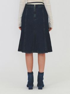 This product is a Gored Denim Midi Skirt that offers a classic denim look with a feminine twist. The gored design creates a flared silhouette, which allows for graceful movement and a timeless appeal. This midi skirt combines the durability of denim with the elegance of a flowy skirt, making it suitable for both casual and more dressed-up occasions. - The skirt features a flared gored design, providing a flattering shape and stylish appearance.- Constructed from sturdy denim, it maintains a casual feel while being suitable for various settings.- Its midi length is both modest and on-trend, offering versatility in footwear options.- Completed with a drawstring waist, it ensures a comfortable, customizable fit. Chic Fitted Dark Wash Denim Skirt, Chic Dark Wash Knee-length Bottoms, Chic Medium Wash Knee-length Skirt, Fitted Dark Wash Denim Midi Skirt, Chic Fitted Knee-length Denim Skirt, Chic Denim Blue Knee-length Skirt, Chic Knee-length Denim Blue Skirt, Lined Denim Flared Skirt, Flared Denim Skirt With Lining