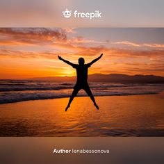 a man jumping into the air on top of a beach at sunset with his arms in the air