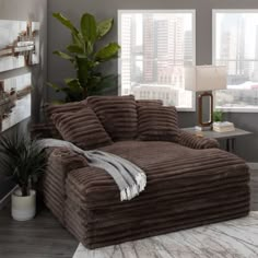 a living room with a large brown couch in it