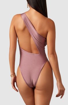 "This one-shoulder swimsuit has a surprise sexy open back design. High cut sides make the legs appear super long and yummy.  This can even be worn with jeans and heels for a super sexy night out! " Double lined High cut at hips – Super trendy 80’s style cut that elongates the legs Cheeky coverage – The most flattering cut One Shoulder Bodysuit For Poolside, One-shoulder Bodysuit For Poolside, One Shoulder Stretch One Piece For Poolside, One-shoulder Stretch One Piece For Poolside, Stretch One-shoulder One-piece For Poolside, One-shoulder Beachwear Bodysuit For Poolside, Stretch One-shoulder One-piece Swimsuit For Pool, Stretch One-shoulder One-piece Swimwear For Pool, One-shoulder Stretch One Piece For Pool