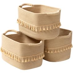 three woven storage baskets with tassels on each side, set against a white background