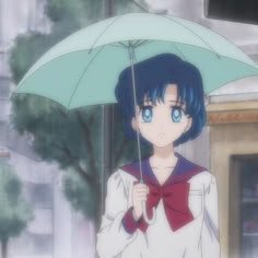 a woman holding an umbrella over her head