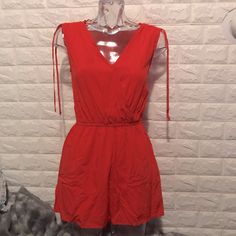 New Coral Red Jumper. With Size Xs With Bags Trendy Red Jumpsuits And Rompers For Summer, Trendy Red Jumpsuits For Summer, Casual Red V-neck Jumpsuits And Rompers, Casual Red V-neck Jumpsuit, Chic Red Jumpsuits And Rompers For Summer, Red Jumpsuits And Rompers For Spring Beach Outings, Red Jumpsuits And Rompers For Beach In Spring, Red Jumpsuits And Rompers For Summer Day Out, Red Jumpsuits And Rompers With Pockets For Beach