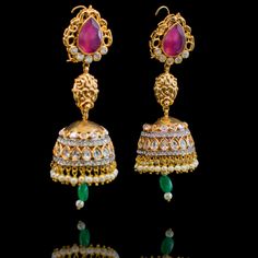 Our Saarika Look sets the mood for vintage glamour with Mughal undertones! A stunning mala necklace in colorful combination of ruby, emerald and CZ stones and beads. Approximate mala length is 15". The look includes a pair beautiful jhumkey earrings. Approximate earrings length is 3.5". Gold-plated on high-quality brass as base metal. In-stock & ready-to-ship. *Please Note: We use faux stones and beads in all of our jewelry. Elegant Multicolor Cutdana Jhumkas, Traditional Emerald Jeweled Jewelry, Fusion Style Kundan Jhumkas With Stone Work, Fusion Style Jeweled Jhumkas For Festivals, Fusion Kundan Jhumkas With Stone Work, Fusion Style Festive Jhumkas With Stone Work, Bollywood Ruby Jhumkas For Festive Occasions, Festive Fusion Jhumkas With Stone Work, Bollywood Style Festive Emerald Jewelry