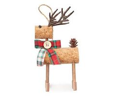 a wooden reindeer with a plaid bow on it's head