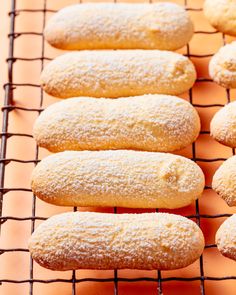 some breads that are sitting on a wire rack and ready to be baked in the oven