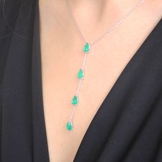 Dazzle with elegance with our 925 Sterling Silver Paraiba Gemstone Y Necklace, featuring a stunning emerald-like appearance that captivates and charms. Elevate your style with our exquisite Paraiba Gemstone Y Necklace, a mesmerizing blend of elegance and sophistication. This handcrafted masterpiece is created with precision and passion, featuring a choice between two stunning versions, each boasting the unparalleled beauty of Paraiba gemstones. Version 1 - Red Paraiba Elegance: Embrace the allur Formal Drop Emerald Gemstone Necklace, Elegant Silver Drop Emerald Necklace, Green Emerald Drop Necklace For Formal Occasions, Green Drop Emerald Necklace For Formal Occasions, Fine Jewelry Silver Pear-shaped Emerald Necklace, Formal Green Emerald Necklace In Sterling Silver, Silver Pear-shaped Emerald Necklace, Fine Silver Pear-shaped Emerald Necklace, Formal Green Emerald Sterling Silver Necklace