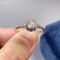 >>>> BASIC OPAL INFORMATION <<<< Round Opal : 5*5mm.Main stone: Natural good fire opal.Side stone: dainty cz diamond (cubic zircon).Material: 925 Sterling Silver +Natural opal stone.Metal color: silver, gold, rose gold. Metal materials: 925 sterling silver, 18K rose gold Plated, 18K rose gold Plated.>>>> SIMPLE DESIGN AND GOOD FIRE <<<>>> CUSTOM METALS <<<< Ring Size: From US #2 to US #15.Supply customized Solid Gold (9K, 14K and Dainty Opal Diamond Ring, Dazzling Opal Gemstone Ring Gift, Opal Gemstone Rings With Round Stone, Opal Gemstone Ring With Round Stone, Diamond And Opal Promise Ring, Promise Opal And Diamond Ring, Promise Opal Ring With Diamond, Elegant Birthstone Ring With Stone Setting, Dazzling White Gold Opal Ring