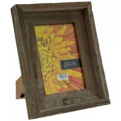 a wooden frame with a yellow flower on the front and bottom, holding a 5x7 photo