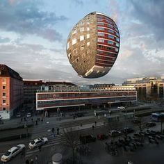 an unusual looking building in the middle of a city