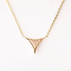 Triangle Pendant, Diamond Pendant, Art Deco Pendant, Triangle Diamond Pendant, Triangle Diamond, diamond pendant, gift, geometric pendantA handmade geometric triangle diamond pendant made in solid 14k gold and set with a triangular diamond.The Pendant is set with a single triangle diamond which gives it a beautiful, clean look.The pictured diamond is 0.2ct.----------------------DIMENSIONS----------------------This beautiful, delicate pendant is about 10mm wide, this would change depending on the Gold Trillion Cut Jewelry With Single Diamond, Trillion Cut Gold Jewelry With Single Diamond, Gold Diamond Triangle Jewelry, Gold Triangle Diamond Jewelry, Gift Trillion Cut Single Diamond Jewelry, Trillion Cut Single Diamond Jewelry For Gift, Minimalist Trillion Cut Diamond Jewelry, Luxury Triangle Jewelry For Gifts, Triangle Diamond