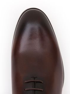 Color: brown Caw leather with natural finish Leather insoles Rubber and leather soles Traditional lace-up closure Hand-stitched detailing Classic Brown Closed Toe Lace-up Shoes, Cognac Oxfords With Leather Sole For Derby, Brown Wingtip Lace-up Shoes With Leather Lining, Cognac Oxfords With Leather Sole, Brown Oxford Dress Shoes With Almond Toe, Brown Cap Toe Lace-up Shoes For Derby, Brown Lace-up Shoes With Textured Sole For Derby, Bridle Leather Oxfords With Almond Toe And Leather Sole, Brown Wingtip Lace-up Shoes In Calf Leather