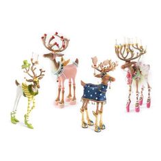 three reindeer figurines are standing next to each other