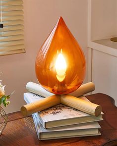 a candle is sitting on top of some books