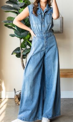 Step into effortless style with the Devin Denim Jumpsuit, featuring a medium-washed denim finish and a chic, sleeveless design. The button-down front and collared neck add a touch of sophistication, while the big cargo chest pocket and back pockets offer practical flair. With a ruched waist back and extra-wide pant legs, this jumpsuit combines comfort and fashion for a versatile, standout look. Measurements (based on flat lay): Small: Chest 17" Waist 14" Hip 21" Length 59" Inseam 31" Medium: Che Medium Wash Button-up Denim Jumpsuit With Buttoned Pockets, Medium Wash Denim Button-up Jumpsuit With Buttoned Pockets, Spring Utility Light Wash Jumpsuits And Rompers, Chic Medium Wash Cotton Denim Jumpsuit, Summer Light Wash Utility Denim Jumpsuit, Medium Wash Denim Jumpsuit With Buttoned Pockets, Summer Utility Style Light Wash Denim Jumpsuit, Light Wash Denim Overalls With Button Closure, Casual Medium Wash Denim Jumpsuit For Work