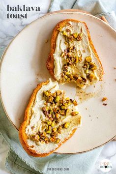 two pieces of bread with white frosting and toppings on top sitting on a plate