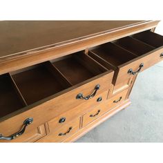 a large wooden dresser with drawers and handles