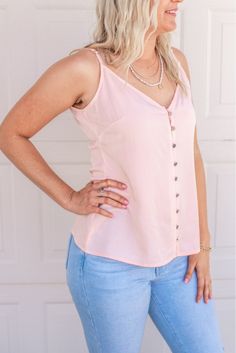 This tank is made for sunny days. The precious light pink color and simple button detailing will add a sweet and simple touch to any look. Throw it on with denim shorts and sandals for summer day activities or tuck into a skirt for brunch with your girlfriends. 70% Viscose, 30% Tencel Model is 5'6", size 34B bust, and shown wearing a size small Fit is true to size Summer Day Activities, Horn Bracelet, Light Pink Color, Summer Day, A Skirt, Summer Days, Sunny Days, Pink Color, Sunnies