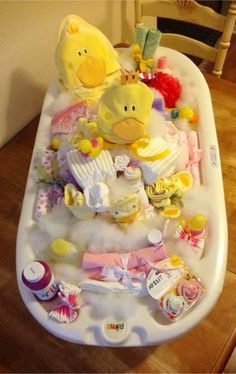 a baby's bathtub filled with lots of toys