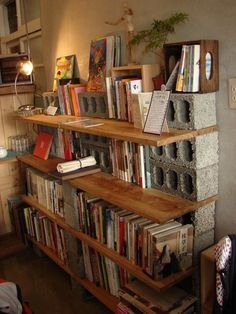 a bookshelf filled with lots of books in a room