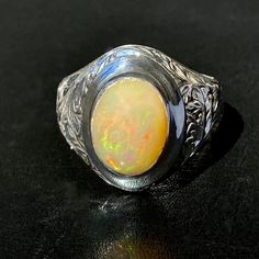 925 STERLING SILVER MEN'S RING WITH NATURAL OPAL Quality meets perfection Handcrafted by Turkish artisan jewelers Unique collectors item METAL : .925 Sterling Silver GEMSTONE: Opal (origin: Africa) DIMENSIONS OF STONES: 10x14 mm SIZE: US 10 Classic Opal Jewelry With Polished Finish, Classic Oval Opal Ring Collectible, Spiritual Hallmarked Signet Ring For Formal Occasions, Hallmarked Oval Rings For Memorial, Formal Sterling Silver Opal Cabochon Ring, Classic Oval Opal Ring In Sterling Silver, Oval White Gold Engraved Ring With Gemstone, Formal Sterling Silver Opal Ring Oval Cabochon, Formal Sterling Silver Opal Ring With Polished Finish