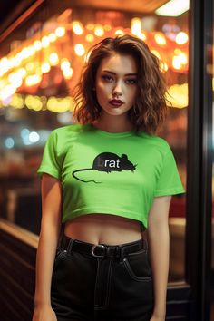 Channel your inner pop icon with the "(b)rat" Charli XCX inspired Crop Top. Crafted from 100% silky soft polyester, it's lightweight, breathable, and ideal for everyday wear. Whether you're heading to a festival, hanging out with friends, or just want to add some fun to your wardrobe, this crop tee is your go-to choice. Embrace your inner (b)rat with this must-have piece! Product Details - 100% polyester - Light fabric (6 oz/yd² (203 g/m - Sewn-in care label - Assembled in the USA from globally Green Hip Hop Top For Summer, Green Hip Hop Tops For Summer, Green Band Merch T-shirt For Summer, Green Short Sleeve Hip Hop Top, Summer Fitted Hip Hop T-shirt, Fitted Hip Hop T-shirt For Summer, Green Short Sleeve Top For Concert, Punk Style Cotton Short Sleeve Crop Top, Punk Style Cotton Crop Top With Short Sleeves