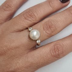 Engagement Gold ring, 14k Gold ring, Gold ring with pearl, ivory pearl gold ring, bridal pearl ring, bridesmaid gift This Shell handmade Gold ring with Pearl is made of 14K genuine gold and set with Natural Pearl. This Stunning Ring is set with Best AAA+ Quality Natural Pearl set in 14k Yellow Gold. High end finish with easy touch of diamond cut. This 14k Gold ring can serve as an engagement ring or a birthday gift. All colors at the picture are available. * Gemstone -8mm Round Natural Pearl. * Elegant Round Halo Ring With Bezel Setting, Yellow Gold Pearl Ring With Center Stone, Elegant Yellow Gold Pearl Ring With Sterling Silver, Elegant 14k Gold Halo Ring For Gift, Elegant 14k Gold Halo Ring As Gift, Elegant Gold Pearl Ring With Center Stone, Elegant Wedding Ring With Bezel Setting, 14k Gold Halo Ring As A Gift, Elegant Yellow Gold Round Pearl Ring