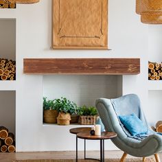 a living room filled with furniture next to a fire place and lots of logs on the wall