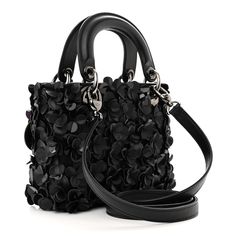 This is an authentic CHRISTIAN DIOR Lambskin Satin Sequin Floral Mini Lady Dior in Black. This delightful mini tote is crafted of lambskin leather with a 3-D floral design in black. The bag has matching black leather top handles and polished silver hardware including a hanging Dior charm and an optional chain crossbody strap. The bag opens to a black leather interior with a zipper pocket. Mini Lady Dior, Black Leather Top, Deer Skin, Polish Silver, Mini Tote, Zip Pouch, Lady Dior Bag, Lady Dior, Lambskin Leather