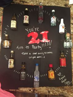 a black board with bottles on it that says, you're 21st birthday