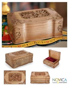 the wooden box is decorated with flowers and scrolls on it's sides, along with other decorative items