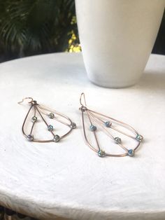 "Delicate but strong, handmade copper wire and Swarovski earrings, using 16g soft copper wire and Swarovski flatbacks. I shape the copper wire into a teardrop, solder the top joint, and add several strands of 22g wire. I place spots of solder on in the copper wire, hammer, and affix crystal flat backs to the solder and finish with a handmade earri wire. Size is approx 2.5\" long x 1.5 at the widest part. Very lightweight, sparkle beautifully when wearing. You can also remove the earring wire, tu Resort Jewelry, Tropical Gifts, Wire Earring, Earring Wire, Beachy Boho, Swarovski Earrings, Handmade Copper, Delicate Earrings, Wire Earrings