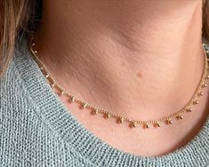 Enhance your sophisticated look with our Dots gold necklace. Crafted with gold fill for a luxurious touch, this adjustable necklace can be styled to your desired length. Elevate your style with this exclusive piece, perfect for adding an elegant touch to any outfit. Delicate 14k Gold Filled Lariat Jewelry, Gold-tone Clavicle Chain Necklace For Gift, 14k Gold Filled Tarnish Resistant Fine Necklace, Delicate 14k Gold Jewelry With Adjustable Chain, Rose Gold 14k Gold-filled Jewelry With Adjustable Chain, Minimalist Choker Jewelry With Adjustable Length, 14k Gold-filled Chain Necklace With Round Pendant, 14k Gold Filled Jewelry As Gift, Minimalist Adjustable Choker Jewelry