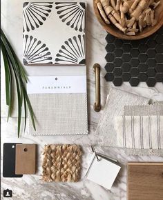 an assortment of items displayed on a marble counter top