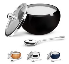 an image of a pan and spoons with different colors on the side, including one black