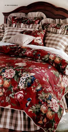 an image of a bed with flowers on the comforter and pillow cases in it